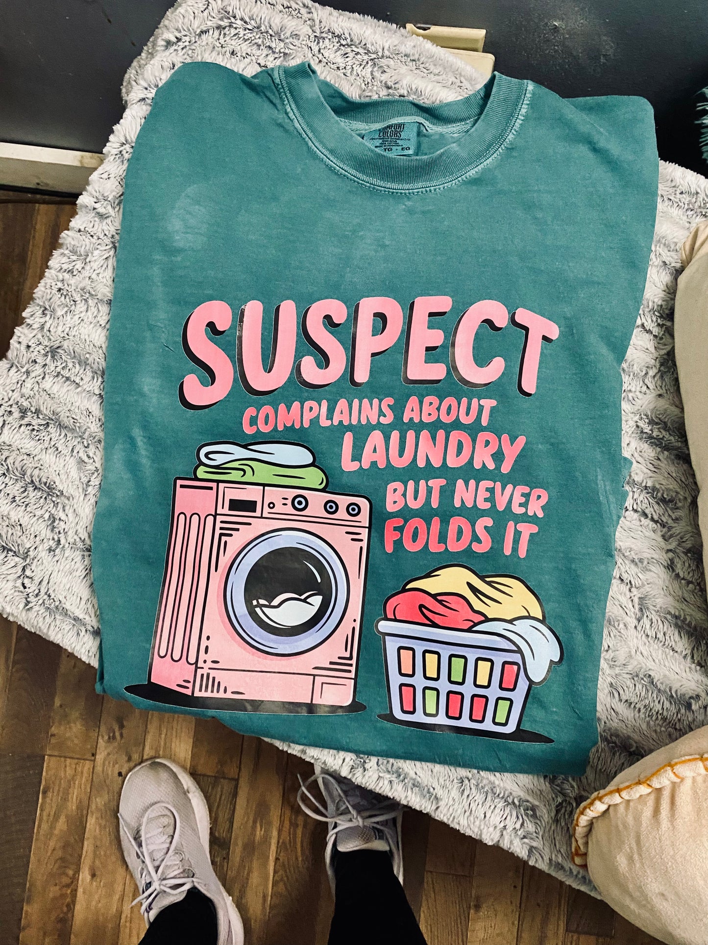 Suspect Complains About Laundry But Never Folds It CC Tee