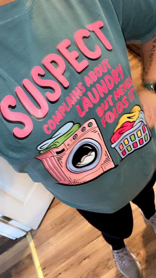 Suspect Complains About Laundry But Never Folds It CC Tee